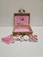 Full set laid out with case open showing utensils and napkins