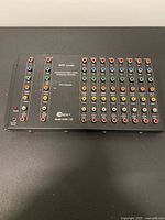 Front view showing full array of input, loop-through and eight output RCA jacks