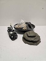 Full set showing basin, faux rock stack, pump, and pebbles