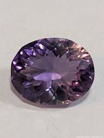 Top view of oval faceted amethyst gemstone