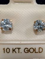 front view of earrings in packaging showing 10kt gold mark