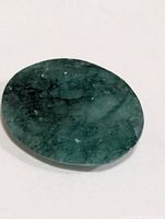 Top view of oval faceted emerald
