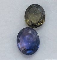 Close-up of both sapphires showing color and cut