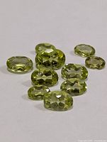 Close view of loose faceted peridots