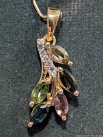 Front view of pendant showing stone arrangement and bail