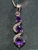 Front view showing three amethyst stones and silver setting