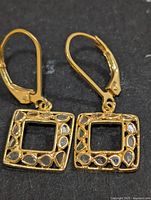 Front view of both earrings showing overall design