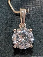 Front view of pendant showing diamond and setting