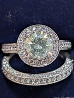 Bridal ring set showing moissanite center and CZ accents