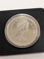 Obverse of Queen Elizabeth II on silver proof coin in capsule