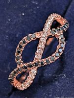 Front view of infinity design ring showing black and clear CZ stones