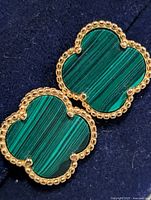 Front view of both earrings showing malachite inlay and gold-tone beaded border
