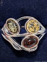 Top view showing three oval cabochon stones and silver setting