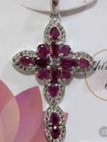 Front view of cross pendant showing stone arrangement