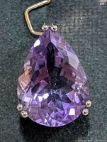Front view pear-cut amethyst in silver setting