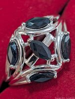 Front view of sterling silver ring with six marquise sapphires