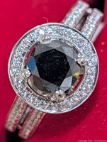 Top view of ring showing black diamond, CZ halo