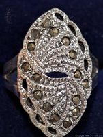 Front view of silver marcasite ring showing navette design and stone placement