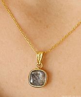 Pendant on chain demonstrating scale and appearance when worn