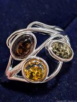 Top view showing tri-stone arrangement and silver setting