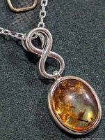 Necklace showing pendant front and chain detail