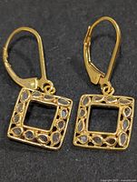 front view of both earrings showing square diamond-set drops and leverbacks