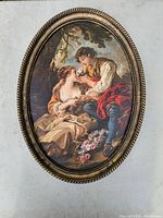 Full view of oval framed cardboard print