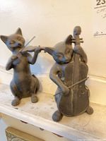 Both cat musician figurines on shelf