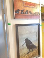 Both framed prints hanging on wall, showing relative sizes and frames