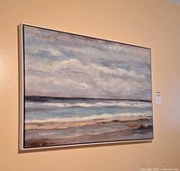 Full view of framed seascape painting on wall