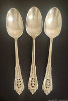 Three Wallace Rosepoint sterling teaspoons front view