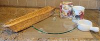 All items together: wicker basket, glass platter, boxed dip warmer components, handled dish