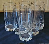 Group view of six clear hexagonal-base highball glasses
