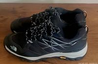 Side view of both shoes showing uppers and laces