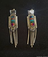 Front view showing multistone inlay and fringe design