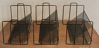 three individual wire racks front view