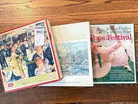 Three Reader's Digest boxed LP sets on wooden surface