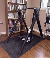 Full view of Air Master stepper on black mat with manual visible