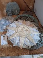 Overview showing sun-face stone and other pieces stacked