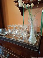 Tray with glasses, pitcher and vase