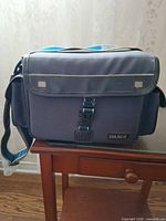 Front view of blue Image brand camera bag showing buckle closure and strap