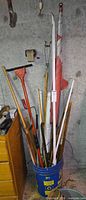 Full lot in bucket: flag, scraper, crowbar, rods, strips, bucket