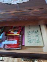 Drawer with packaged bulbs, clips, picks and boxed candles