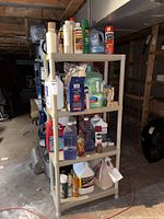 Full shelving unit with multiple cleaning products