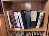 Shelf showing full assortment of books and binders