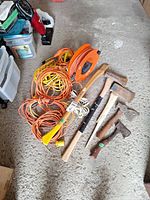 Overall lot with extension cords, cord reel, five axes/hatchets