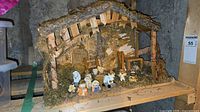 Full view of stable with all miniature nativity figures displayed