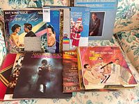 Stack of various LPs including Nat King Cole, George Beverly Shea, Amazing Grace, others.