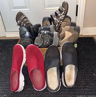 All eight pairs in basket plus two Skechers pairs in front