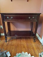 Front view of console table showing drawer, shelf and overall design